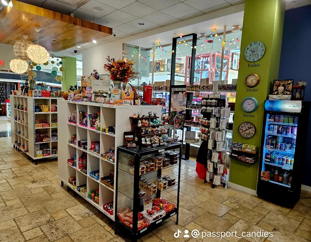 Passport Candies store interior showcasing colorful displays of international candies and snacks from around the world