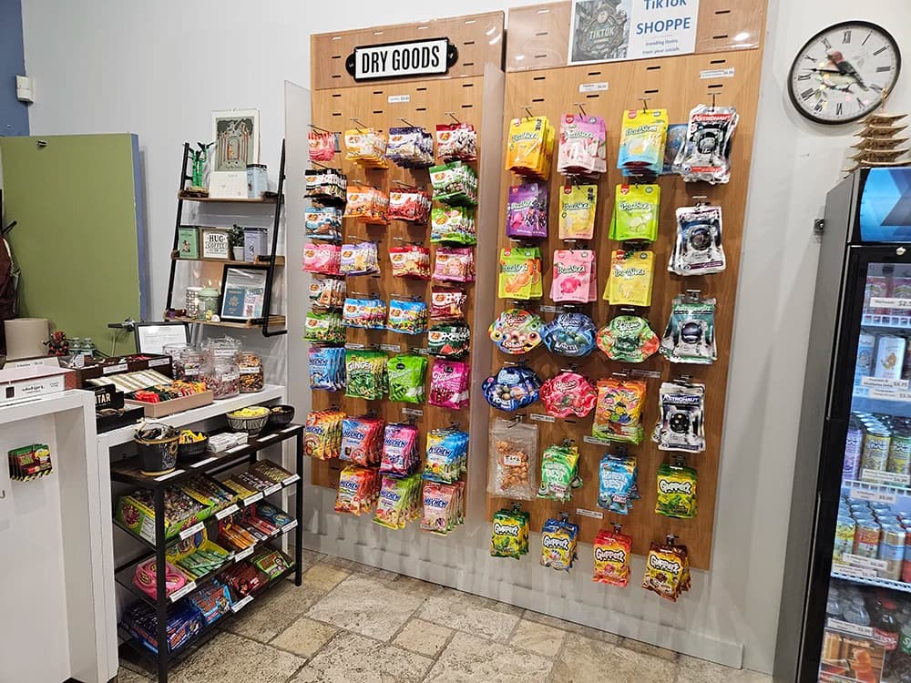 Store display featuring diverse collection of international snacks and candies from various countries
